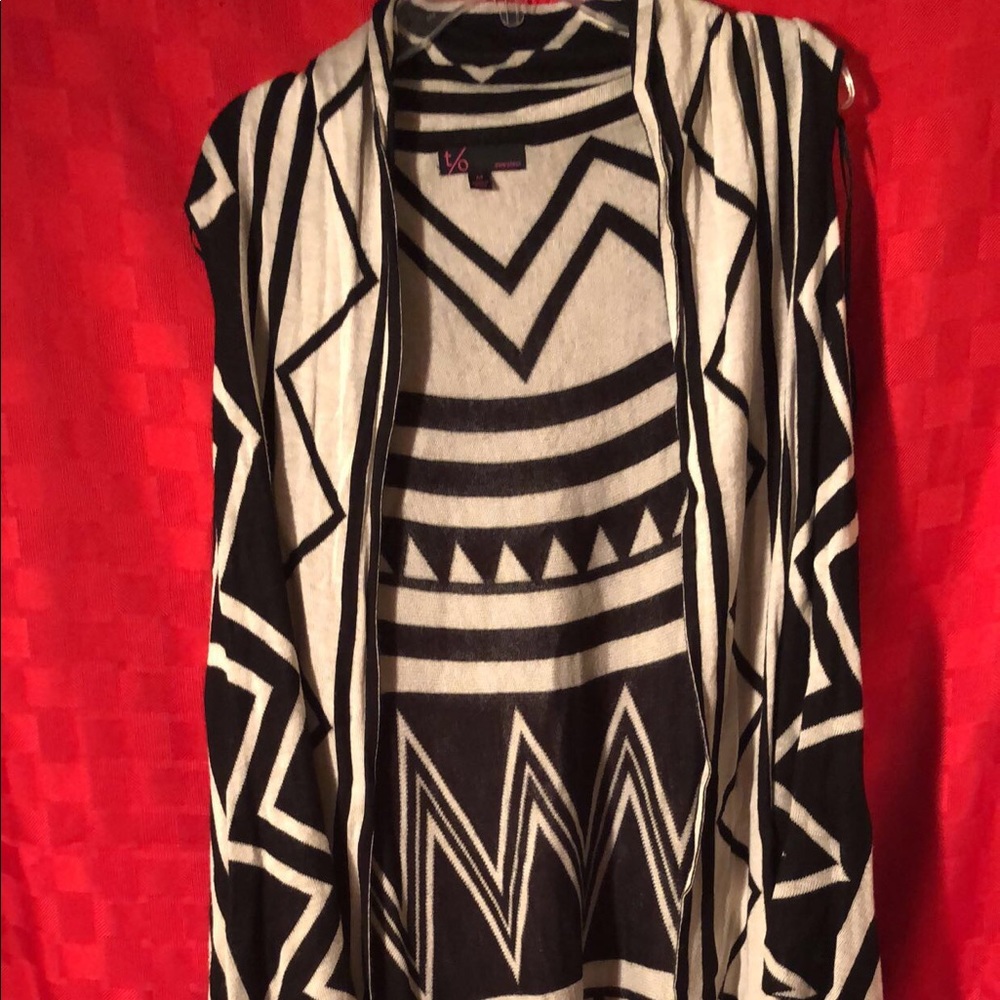 Sleeve-less throw over sweater